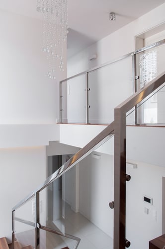 Vertical view of stairs with steel railing