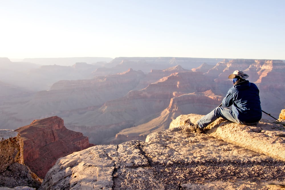 Man at the Grand Canyon looking at the great view
